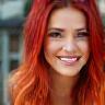 Sophie W. grinning after her hair color service